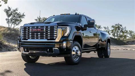 gmc truck with a dump truk skid steer|gmc sierra hd pickup truck.